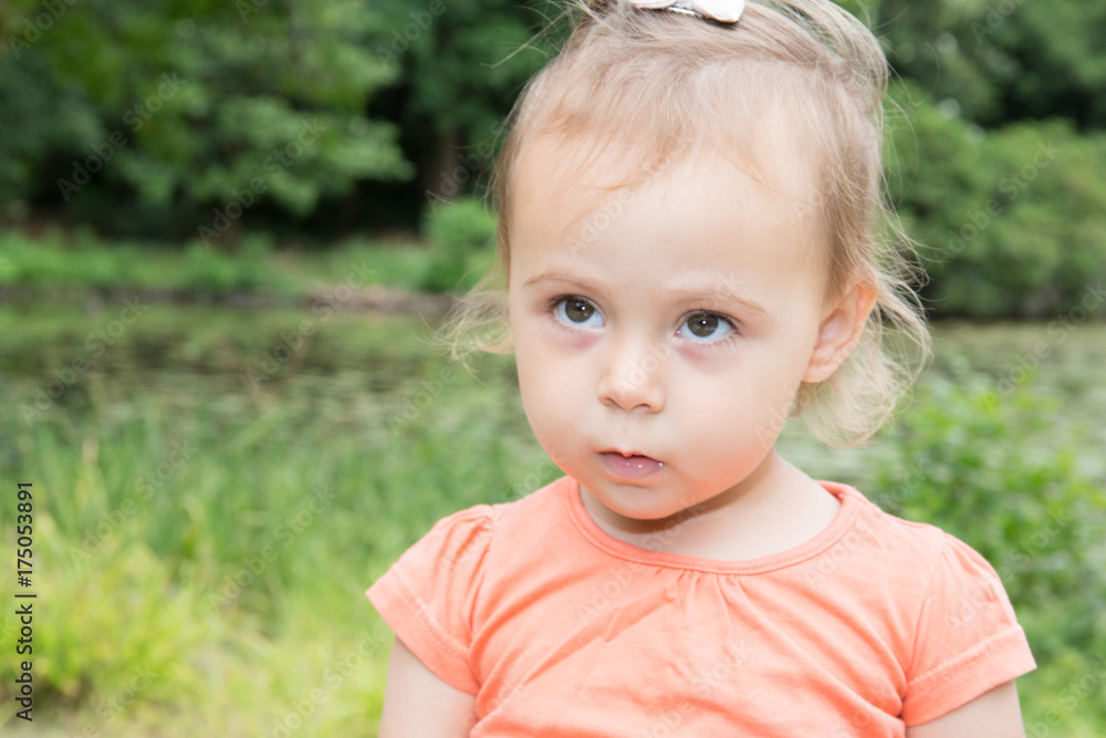 Portrait of a sad curly little girl Portrait of a sad curly little girl