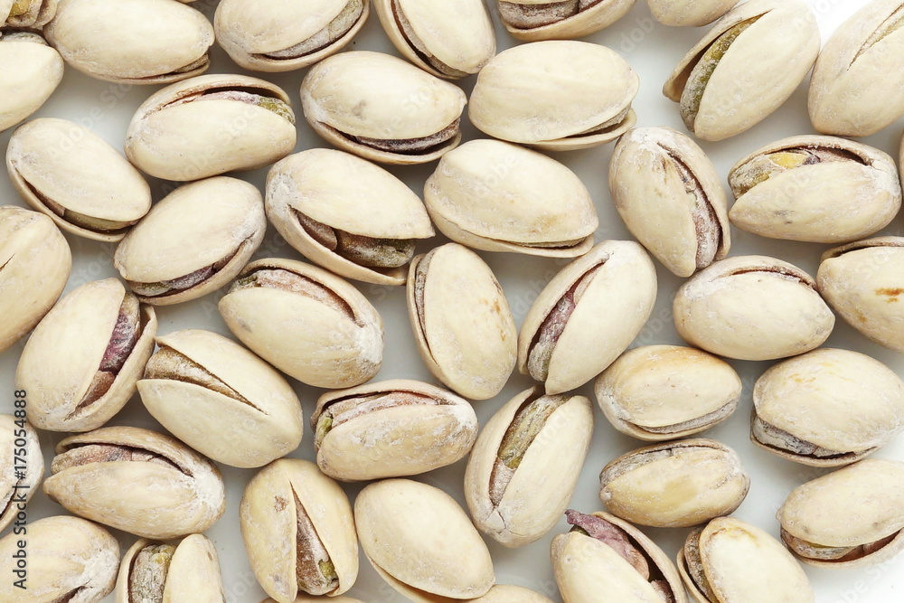 salted pistachio nuts background close up