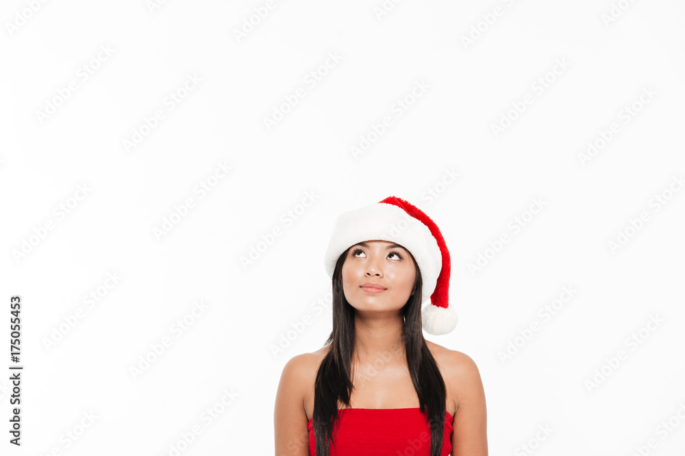 Portrait of a smiling asian woman in red christmas costume Portrait of a smiling asian woman in red christmas costume