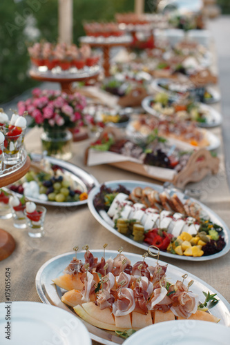 Outdoors fourchette table with italian appetizers and fresh flowers