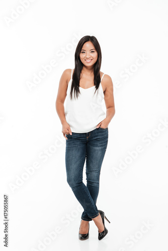 Full lemgth portrait of a casual smiling asian woman