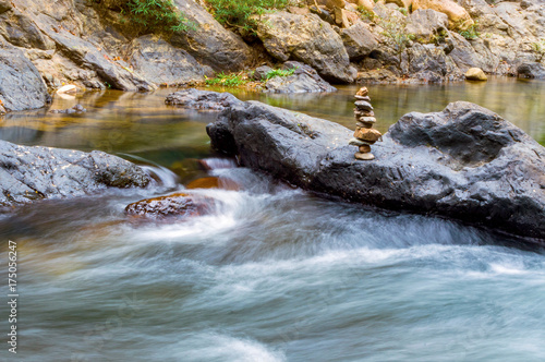 Stones in mountain river in forest. photo