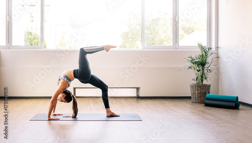 Fototapeta Naklejka Na Ścianę i Meble -  Woman practicing yoga for good health