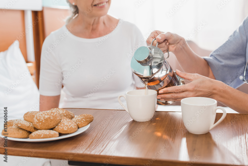 nurse and patient drinking tea