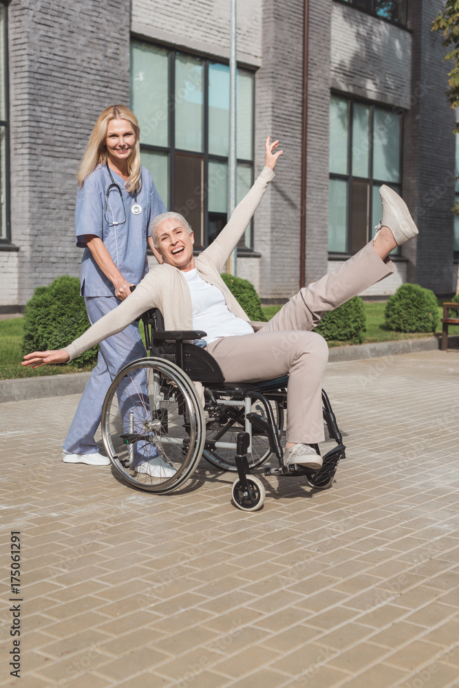 nurse and senior woman in wheelchair nurse and senior woman in wheelchair