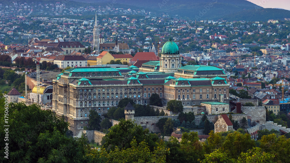 Budapest, Hungary - The beautiful Buda Castle Royal Palace with the Buda hills and the Matthias Church at background at sunset
