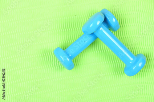 Shaping and fitness equipment. Barbells in small size, close up.