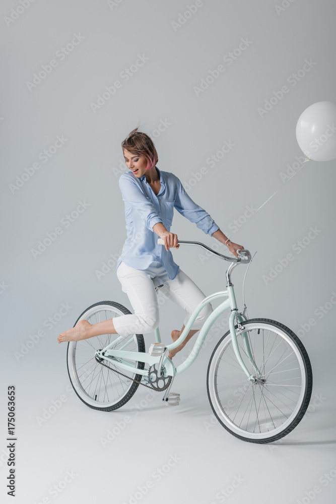 charming girl on bike with balloon charming girl on bike with balloon