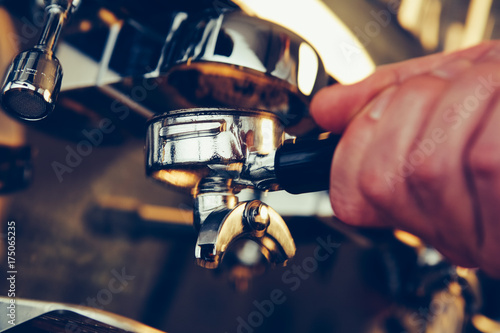 Barista preparing espresso at coffee shop