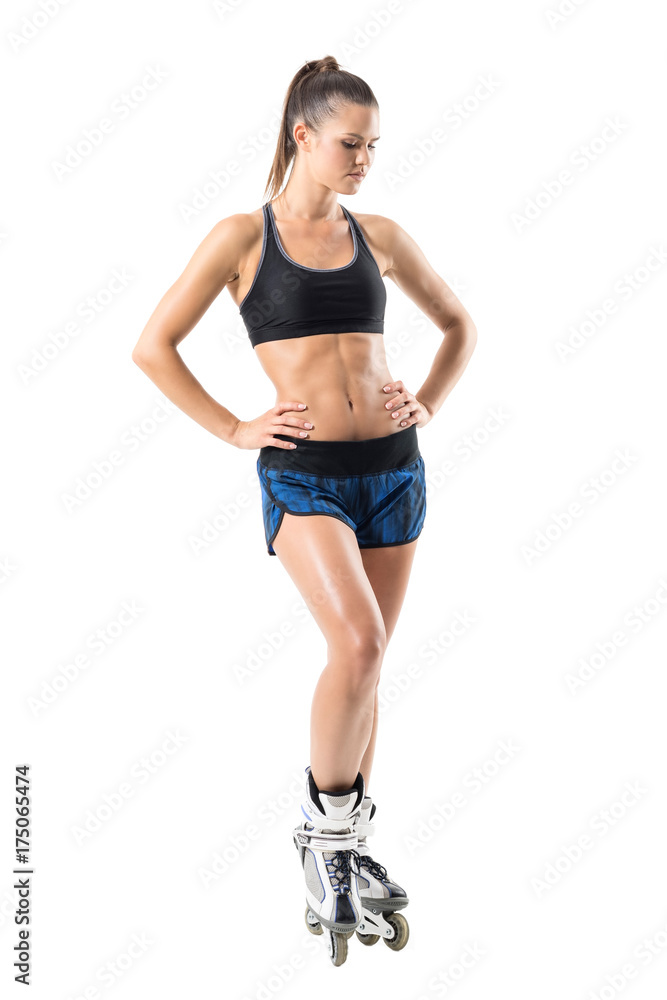 Sad pensive fit woman with roller skates looking down. Full body length portrait isolated on white studio background. Sad pensive fit woman with roller skates looking down. Full body length portrait isolated on white studio background.