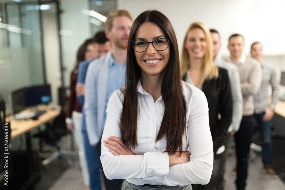 Fototapeta premium Successful team of young perspective businesspeople in office