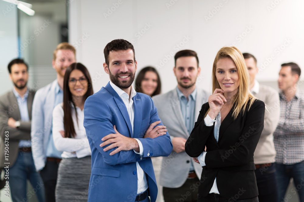 Successful team of young perspective businesspeople in office Successful team of young perspective businesspeople in office
