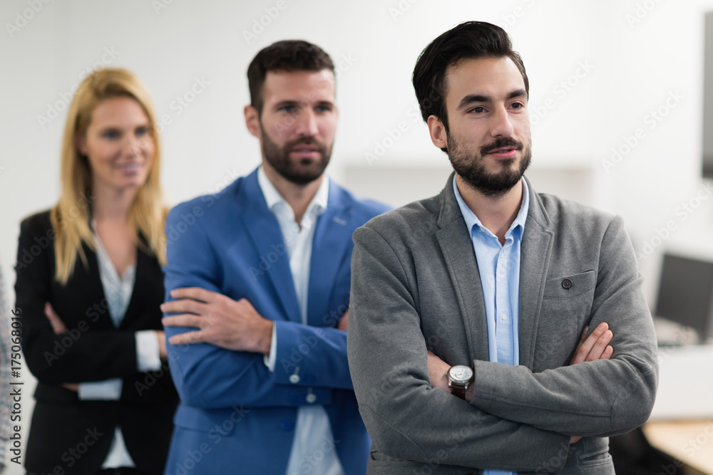 Successful team of young perspective businesspeople in office Successful team of young perspective businesspeople in office