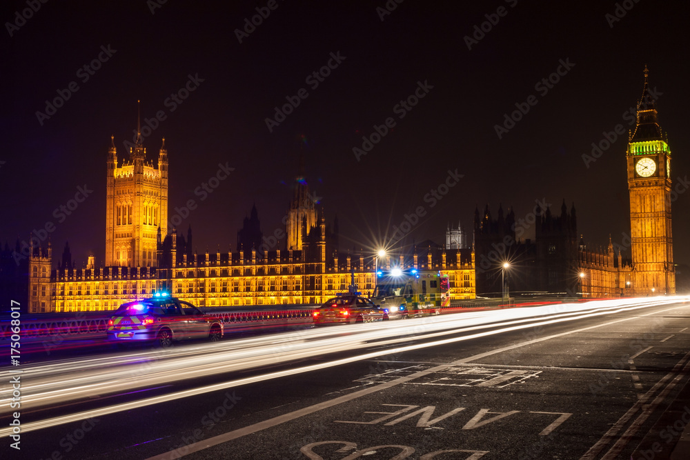 Police Cars and Ambulance on Westminster Bridge, London at Night