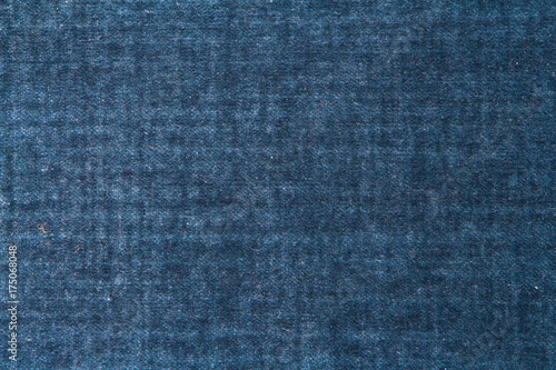 Texture of blue vintage fabric with a pattern in retro grunge style