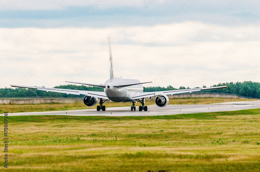 Passenger plane jet taxiing along the runway. Passenger plane jet taxiing along the runway.
