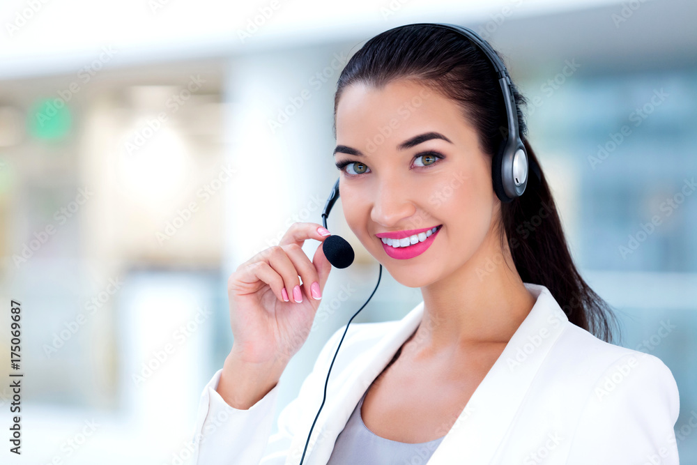 Closeup portrait of support phone operator in headset at workplace Closeup portrait of support phone operator in headset at workplace