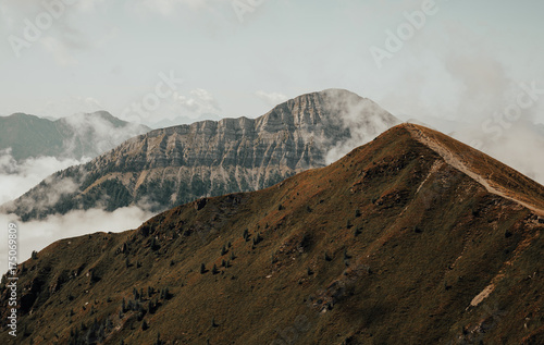 Minimalist landscape of  mountains. Mountain peaks in the clouds photo
