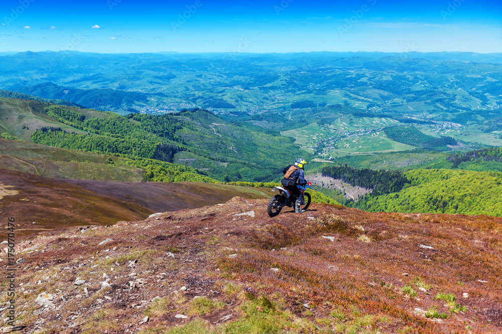 motorcyclist riding in the mountains