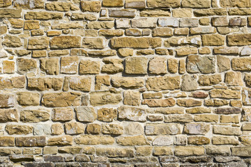 Fototapete Steine Antike (alte) Natursteinwand, Hintergrund, Textur oder Muster. Steinmauer rustikale Textur. Wand mit Ziegeln aus italienischen Steinen.  © yelena.b