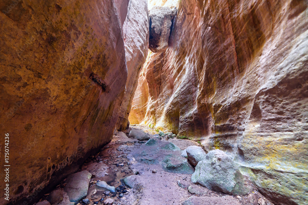 Sunlit multicolored rocks of Avakas canyon
