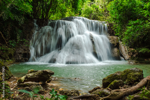 scenery view. beautiful waterfall among the tree in the deep forest are background. this image for nature, landscape, forest  concept