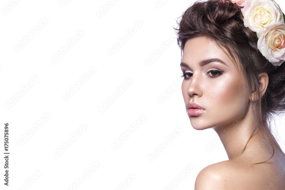 Obraz premium Beauty young girl, clean skin, beautiful make-up, hairstyle braids and rose flowers in hair.