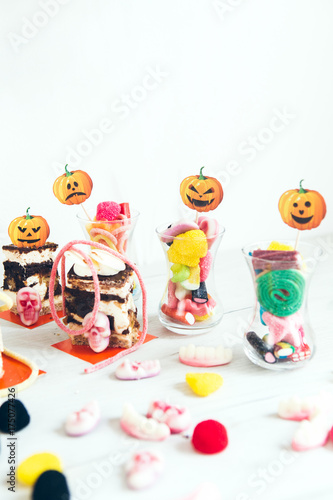 Halloween party decoration. Candies in glass  