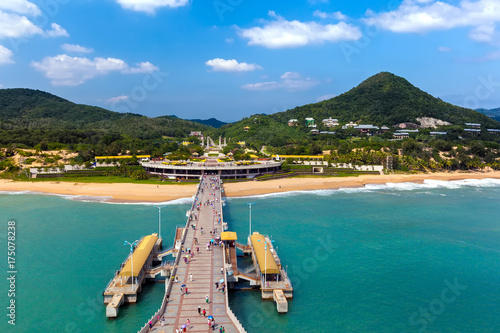 The coastline of Nanshan Buddhist Cultural Park, Sanya, Hainan Island, China. The bridge leads to a Buddha statue.