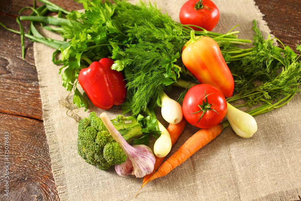 salad from fresh vegetables in a plate on a table, selective focus salad from fresh vegetables in a plate on a table, selective focus