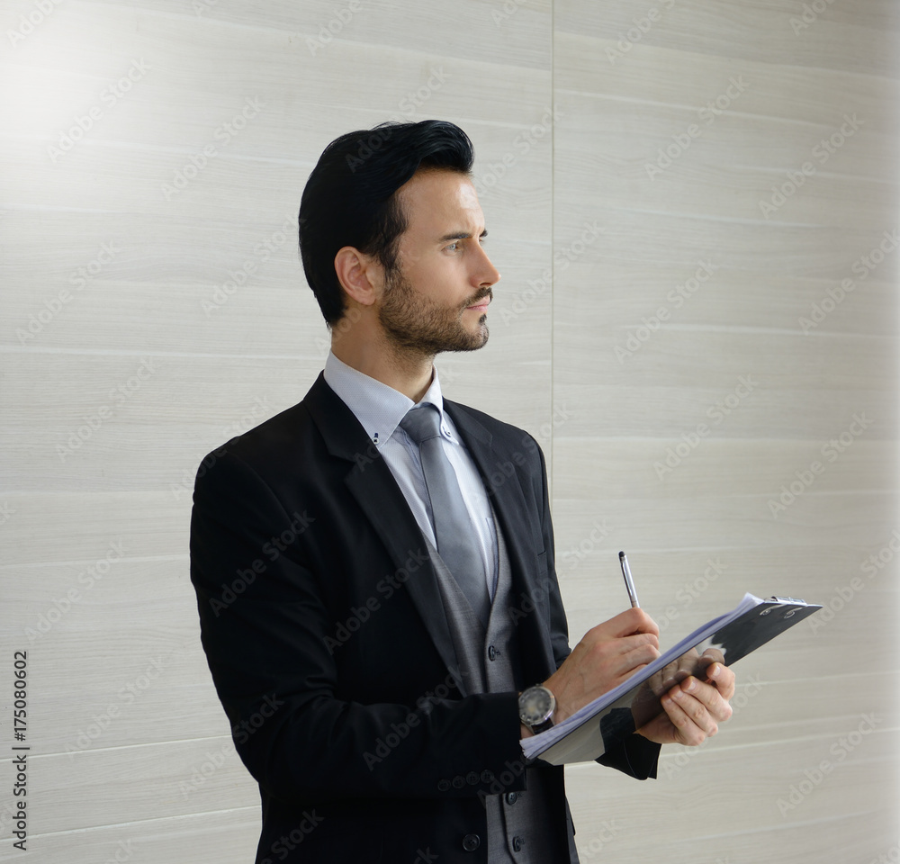 Portrait of young business man working in office Portrait of young business man working in office