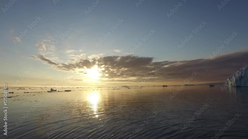 Arctic Icebergs Greenland in the arctic sea. You can easily see that iceberg is over the water surface, and below the water surface. Arctic Icebergs Greenland in the arctic sea. You can easily see that iceberg is over the water surface, and below the water surface.