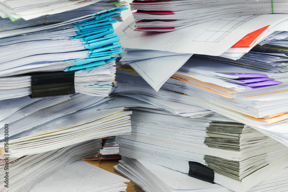 Paper documents stacked in archive Paper documents stacked in archive