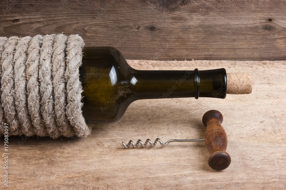 Old  bottle of wine and corkscrew