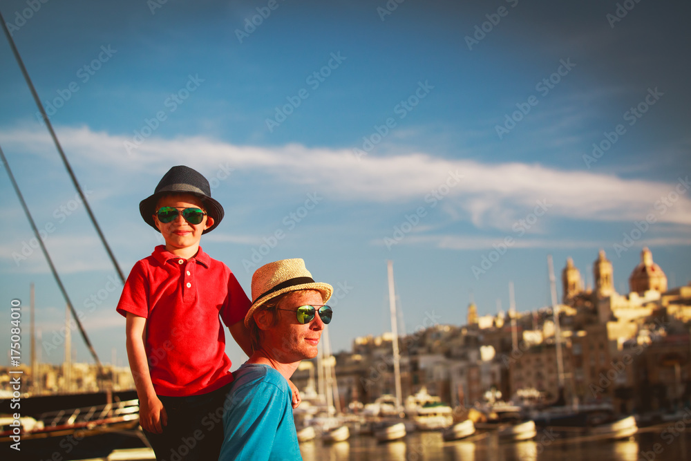 father and son playing on quay of Valetta, Malta