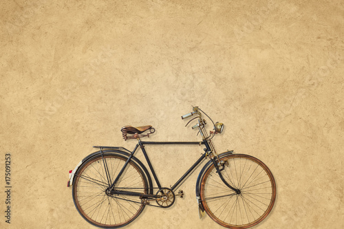 Vintage bicycle in front of a sepia background