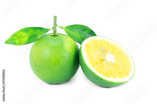 Fresh ripe limes with leaves isolated on white background
