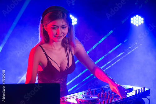 Dj was remix music in pub, Woman with Dj concept. Attractive Woman Remixed Music alone.