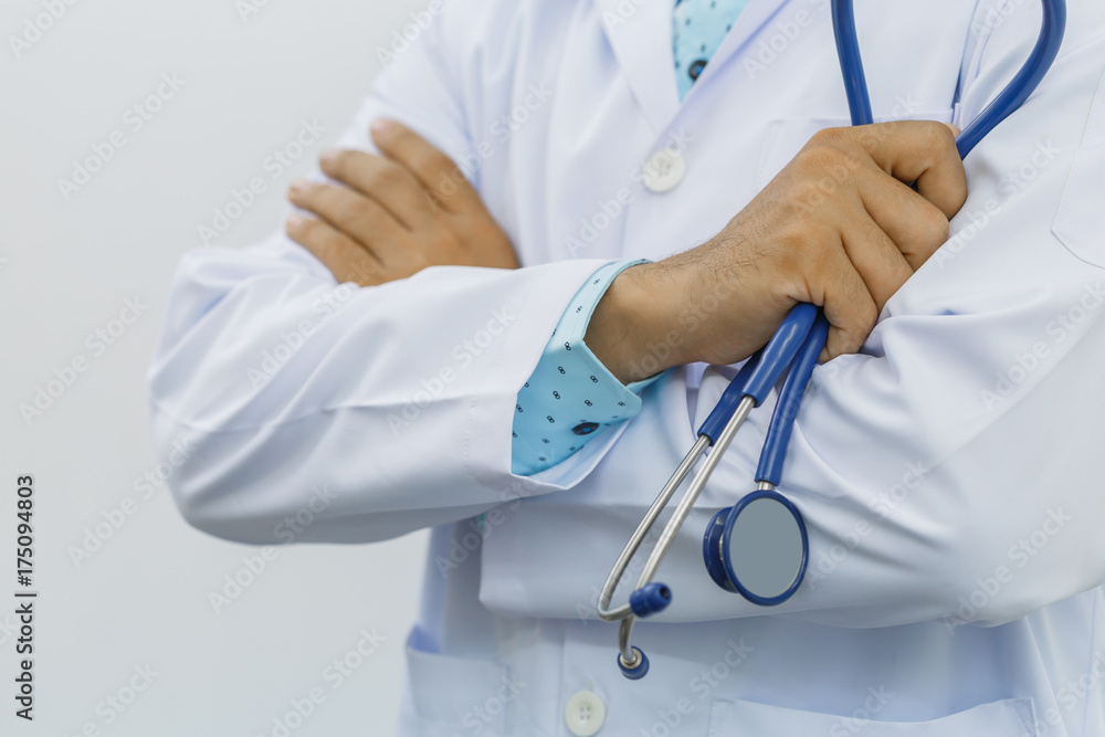 Doctor arms crossed with stethoscope, isolated on white background, concept of business advertising and consultation treatment patient. Doctor arms crossed with stethoscope, isolated on white background, concept of business advertising and consultation treatment patient.
