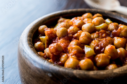 Chana Masala Chickpeas in wooden bowl.