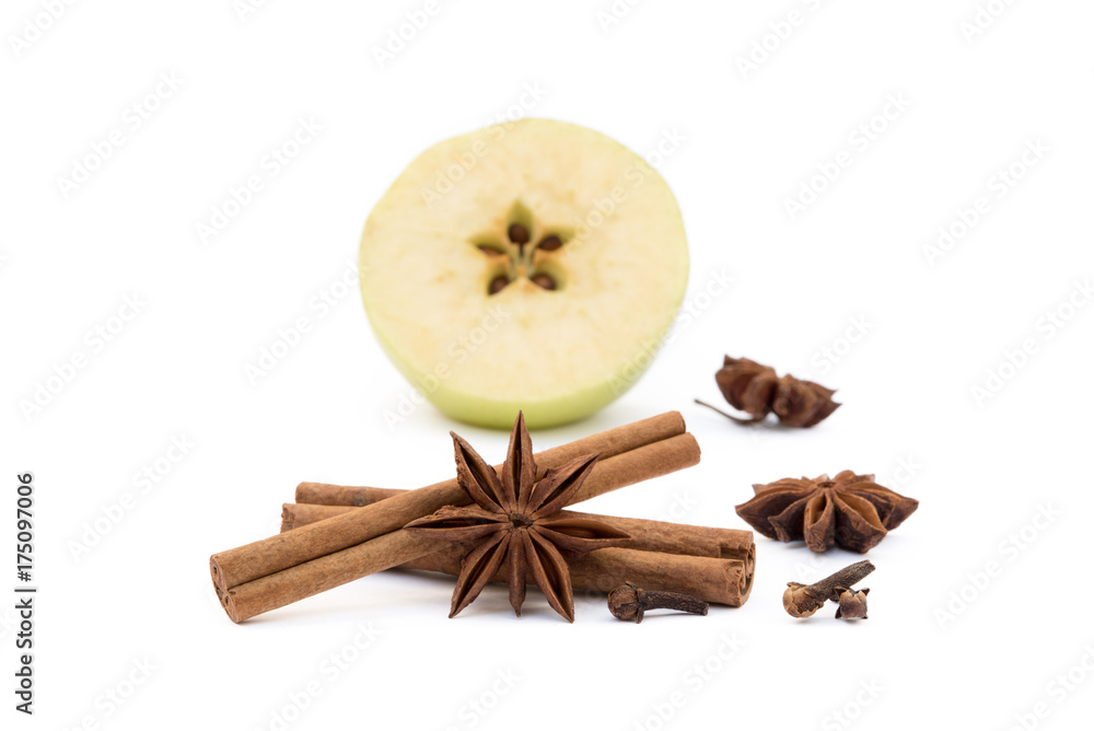 apple, star anise, cloves and cinnamon isolated on white background apple, star anise, cloves and cinnamon isolated on white background