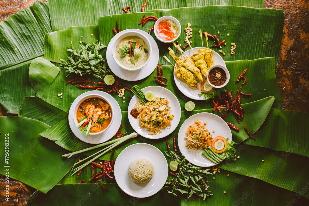 © Nabi Tang/Stocksy - Variety of authentic thai traditional meal set on green banana leaves