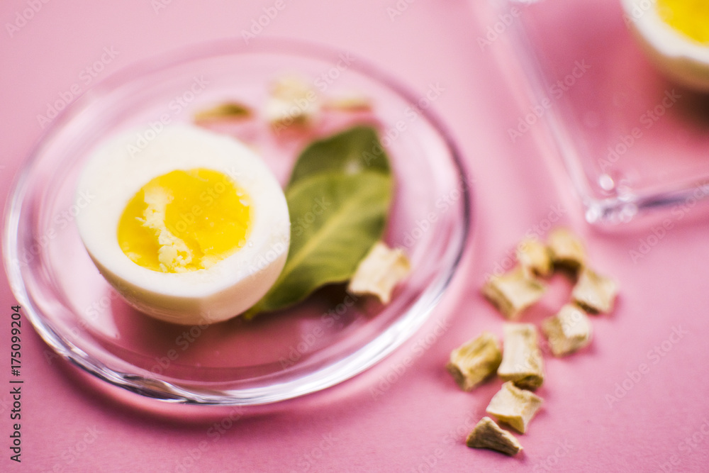 Boiled egg on a plate with vegetables and Bay leaf Boiled egg on a plate with vegetables and Bay leaf
