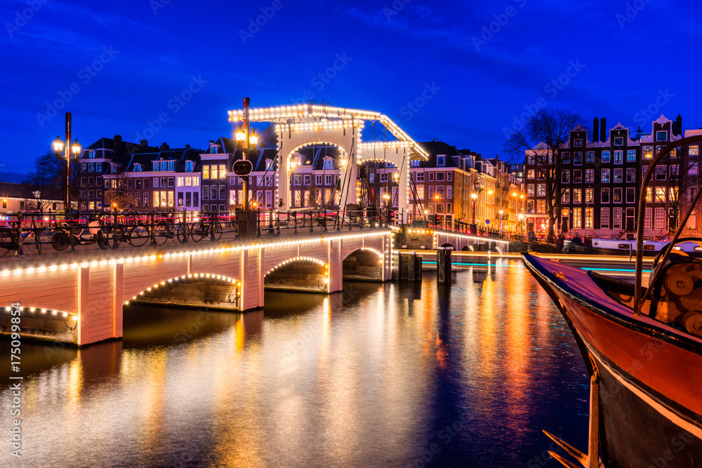 Skinny Bridge and Amstel River in Amsterdam Netherlands at Dusk
