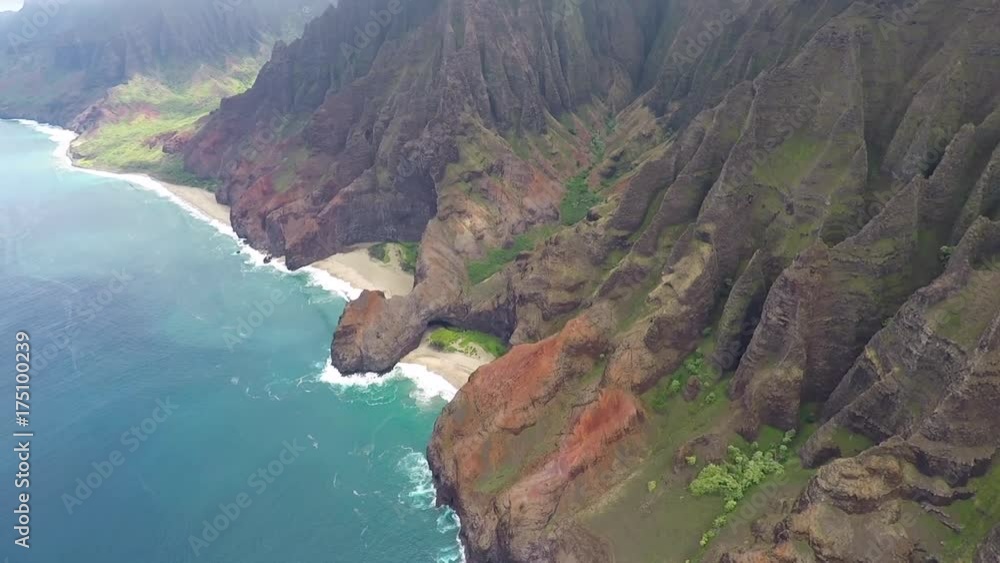 POV flying airplane. Garden Isle. Waimea Canyon State Park and Na Pali coast. Volcanic mountain geology. Economy is tourism based. POV flying airplane. Garden Isle. Waimea Canyon State Park and Na Pali coast. Volcanic mountain geology. Economy is tourism based.