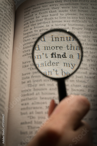 View through loupe at book. Word - find
