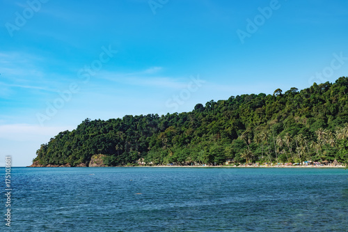 View of the White Sand Beach, Chang island,Thailand. Unidentified tourists enjoying their holidays on Thai beach at hot summer day