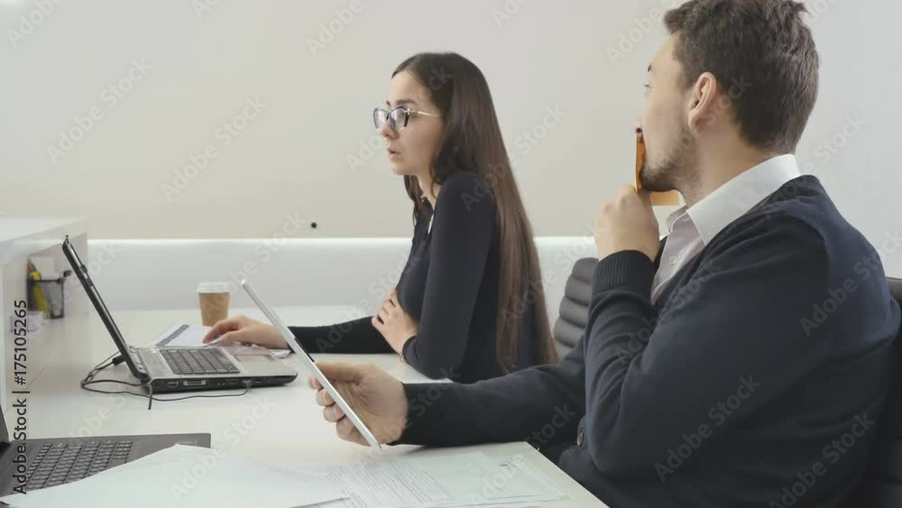 Funny businessman smiles with a sticker on mouth to colleague in the office Funny businessman smiles with a sticker on mouth to colleague in the office
