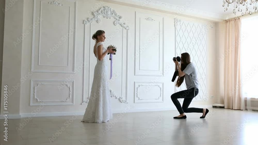 Photographer taking pictures the young sexy bride Photographer taking pictures the young sexy bride