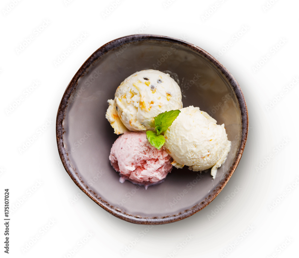 Assorted ice cream scoops in bowl isolated